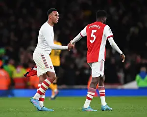 Arsenal: Gabriel Magalhaes and Thomas Partey Share a Moment after Arsenal vs. Wolverhampton Wanderers (2021-22)