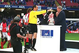 Arsenal goalkeeper David Seaman collects his medal from Leonart Johanssen