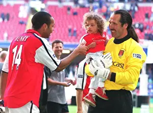 Arsenal goalkeeper David Seaman with daughter Georgina and Thierry Henry after the match