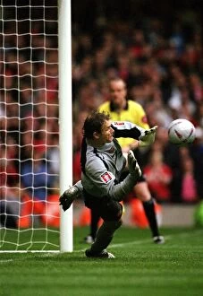Trophies Collection: Arsenal goalkeeper Jens Lehmann prepares to save the 2nd Manchester United penalty taken by Paul Sch