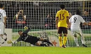Images Dated 28th September 2010: Arsenal goalkeeper Lucasz Fabianski saves the penalty from Cleo (Partizan)
