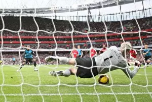 Arsenal goalkeeper Manuel Almunia save a penalty from Ashley Young