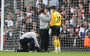 West Ham United v Arsenal 2009-10 Collection: Arsenal goalkeeper Vito Mannone it treated by physio Colin Lewin