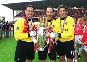 Arsenal goalkeepers Richard Wright, David Seaman and Stuart Taylor lift the F.A