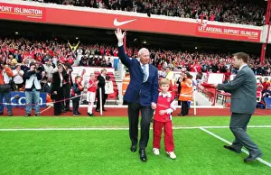 Arsenal goalkeeping coach Bob Wilson waves goodbye to the Arsenal fans