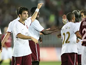 Arsenal goalscorer Cesc Fabregas points at provider Gael Clichy