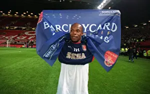 Man Utd V Arsenal Prints: Arsenal goalscorer Sylvain Wiltord celebrates after the match