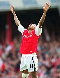 Arsenal golden boot winner Thierry Henry celebrates at the final whistle
