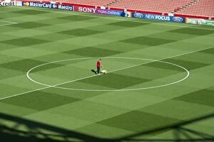 Images Dated 28th September 2011: Arsenal Groundsman Paul Ashcroft makes out the pitch before the match. Arsenal 2: 1 Olympiacos