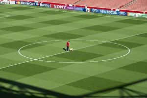 Images Dated 28th September 2011: Arsenal Groundsman Paul Ashcroft makes out the pitch before the match. Arsenal 2: 1 Olympiacos