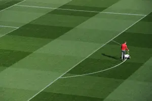 Arsenal Groundsman Prepares Emirates Turf for Arsenal vs. Bayern Munich Champions League Clash