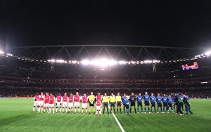 The Arsenal and Hamburg teams line up before the match