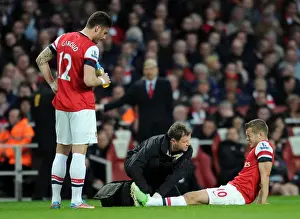 Everton Prints: Arsenal: Jack Wilshere Receives Treatment from Colin Lewin as Olivier Giroud Looks On during Arsenal v Everton (2013)