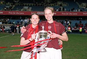 Arsenal Ladies Celebrate FA Cup Victory: Kelly Smith and Faye White Hold the Trophy after 5-0 Win over Leeds United Ladies