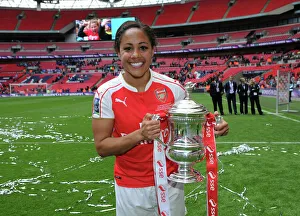 Arsenal Ladies Celebrate FA Cup Victory: Alex Scott Lifts the Trophy Over Chelsea Ladies at Wembley Stadium