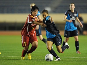 Arsenal Ladies Rachel Yankey vs. Megumi Takase: A 1-1 Draw in Charity Match between Arsenal Ladies and INAC Kobe at Nishigaoka Stadium, Tokyo (November 30, 2011)