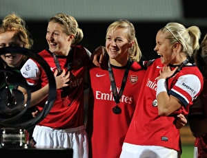 Arsenal Ladies Triumph in FA WSL Continental Cup Final: Ellen White, Gemma Davison, and Steph Houghton Celebrate with the Trophy