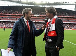 Arsenal v Norwich City 2013-14 Collection: Arsenal legend Robert Pires is interviewed during half time. Arsenal 4: 1 Norwich City