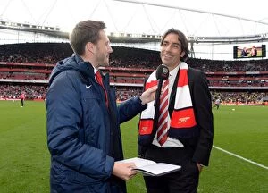 Arsenal v Norwich City 2013-14 Collection: Arsenal legend Robert Pires is interviewed during half time. Arsenal 4: 1 Norwich City