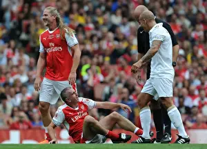 Arsenal Legends V Milan Glorie Prints: Arsenal Legends vs. Milan Glorie: A Lighthearted Moment Between Nigel Winterburn and Paolo Di Canio