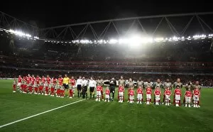 Images Dated 24th November 2009: The Arsenal and Liege teams line up with their mascots