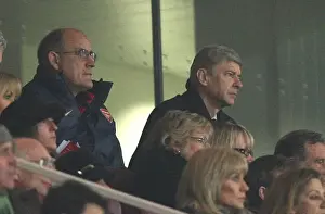 Arsenal manager Arsene Wenger and 1st team Coach watch the match from the Directors box