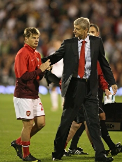 Wenger Arsene Collection: Arsenal manager Arsene Wenger with Andrey Arshavin