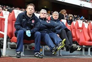 Images Dated 30th January 2011: Arsenal manager Arsene Wenger with assistant manager Pat Rice and physio Colin Lewin