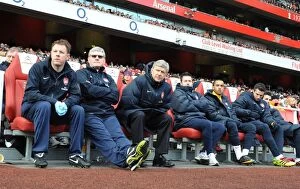 Images Dated 30th January 2011: Arsenal manager Arsene Wenger with assistant manager Pat Rice and physio Colin Lewin