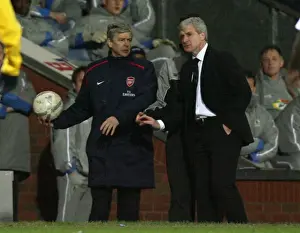 Arsenal manager Arsene Wenger with Blackburn Rovers manager Mark Hughes