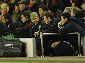 Arsenal manager Arsene Wenger checks the time with physio Colin Lewin. Liverpool 1 Arsenal manager Arsene Wenger checks the time with physio Colin Lewin. Liverpool 1