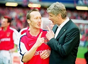 Arsenal v Chelsea FA Cup Final Collection: Arsenal manager Arsene Wenger with defender Lee Dixon after the match