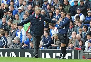 Images Dated 28th August 2010: Arsenal manager Arsene Wenger with fourth official Lee Probert. Blackburn Rovers 1
