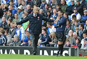 Arsenal manager Arsene Wenger with fourth official Lee Probert. Blackburn Rovers 1