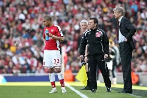 Arsenal manager Arsene Wenger and Gael Clichy