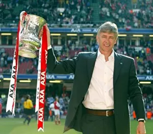 Arsenal v Chelsea FA Cup Final Collection: Arsenal manager Arsene Wenger lifts the FA Cup after the match