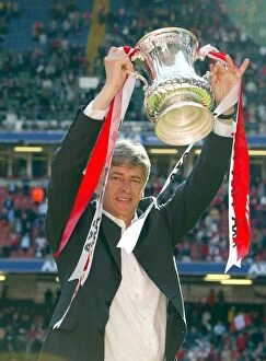 Arsenal v Chelsea FA Cup Final Collection: Arsenal manager Arsene Wenger lifts the FA Cup after the match
