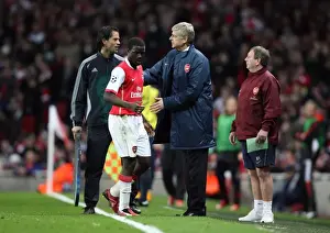 Arsenal V Liverpool Champions League 2007-08 Prints: Arsenal manager Arsene Wenger pats Emmanuel Eboue on the back after his substitution