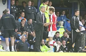Arsenal manager Arsene Wenger shakes hands with Aaron