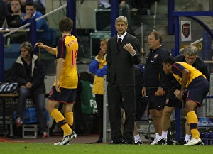 Images Dated 13th August 2008: Arsenal manager Arsene Wenger talks to Aaron Ramsey during the match