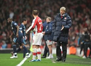 Arsenal v West Ham United 2009-10 Collection: Arsenal manager Arsene Wenger talks with Andrey Arshavin during the match