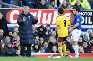 Arsenal manager Arsene Wenger talks with Samir Nasri during the match. Everton 1