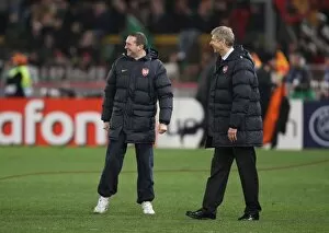 Images Dated 11th March 2009: Arsenal manager Arsene Wenger & travel manager celebrate