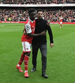 Arsenal v Crystal Palace 2022-23 Collection: Arsenal Manager Mikel Arteta Celebrates with Bukayo Saka after Arsenal's Victory over Crystal