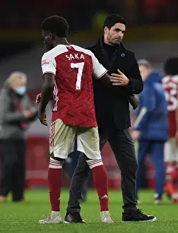 Arsenal Manager Mikel Arteta Celebrates with Bukayo Saka after Arsenal's Victory over Burnley (2020-21)
