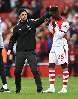 Arsenal Manager Mikel Arteta Celebrates with Flo Balogun after Arsenal vs. Chelsea Win