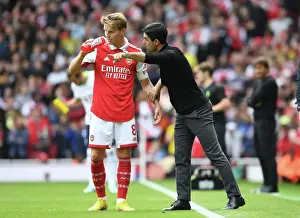 Arsenal Manager Mikel Arteta Conferencing with Martin Odegaard Amidst Arsenal v Tottenham Rivalry (2022-23)