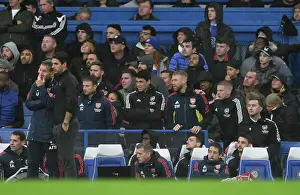 Arsenal Manager Mikel Arteta Discusses Tactics with Assistant Coach Albert Stuivenberg during Chelsea vs Arsenal (2022-23)