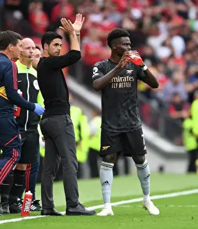 Manchester United V Arsenal 2022-23 Prints: Arsenal Manager Mikel Arteta Guides Bukayo Saka at Manchester United's Old Trafford (Premier League 2022-23)