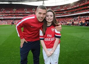Images Dated 18th January 2014: Arsenal mascot with Lukas Podolski (Arsenal). Arsenal 2: 0 Fulham. Barclays Premier League